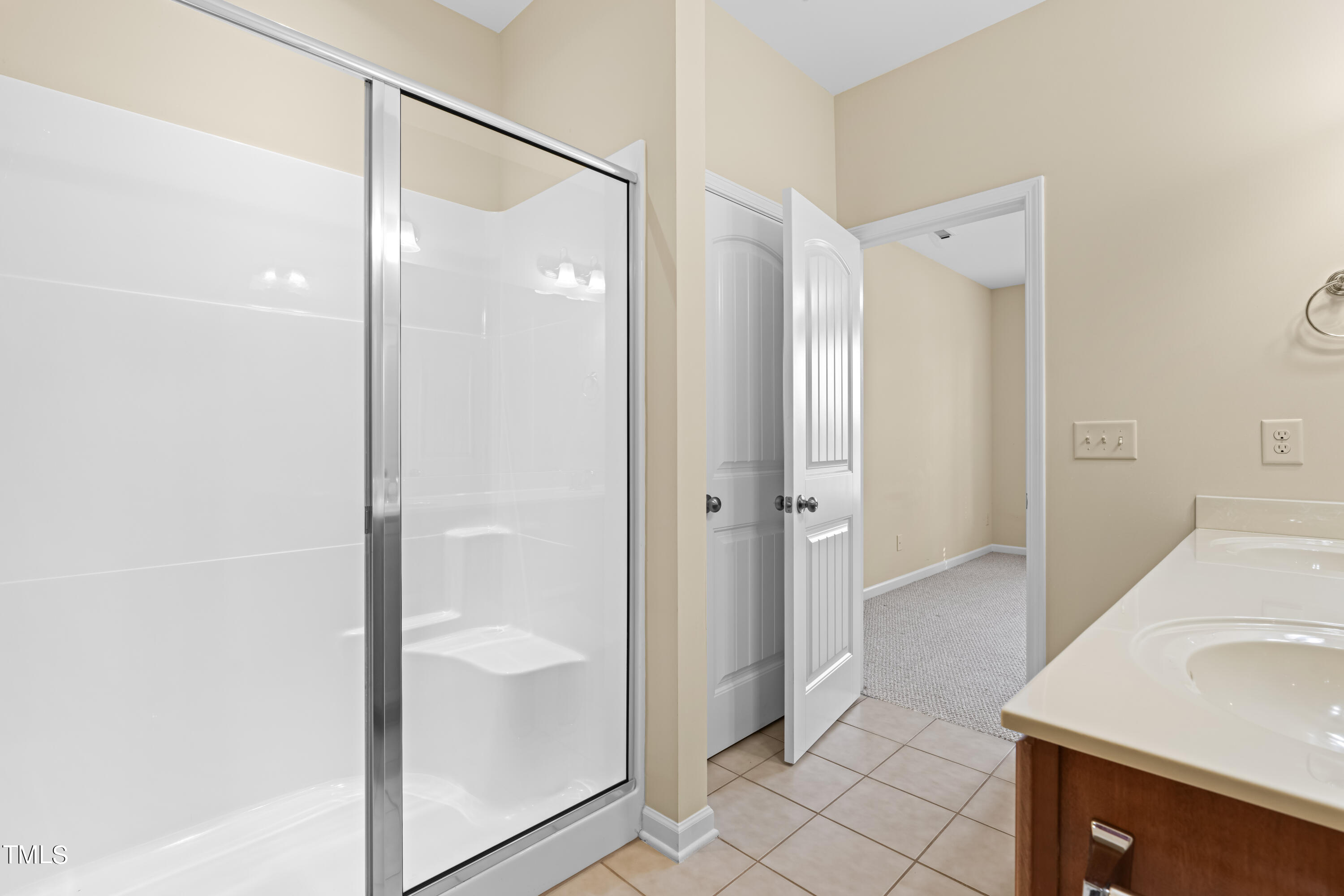 1305 Silver Beach Way Raleigh, NC 27606 - Photo 19 of 47 a bathroom with a shower and a sink