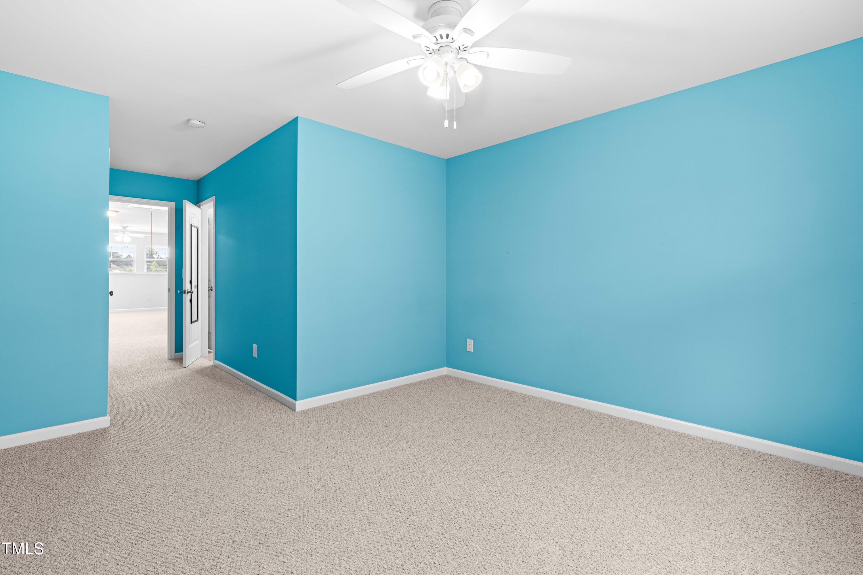 1305 Silver Beach Way Raleigh, NC 27606 - Photo 26 of 47 an empty room with closet and fan