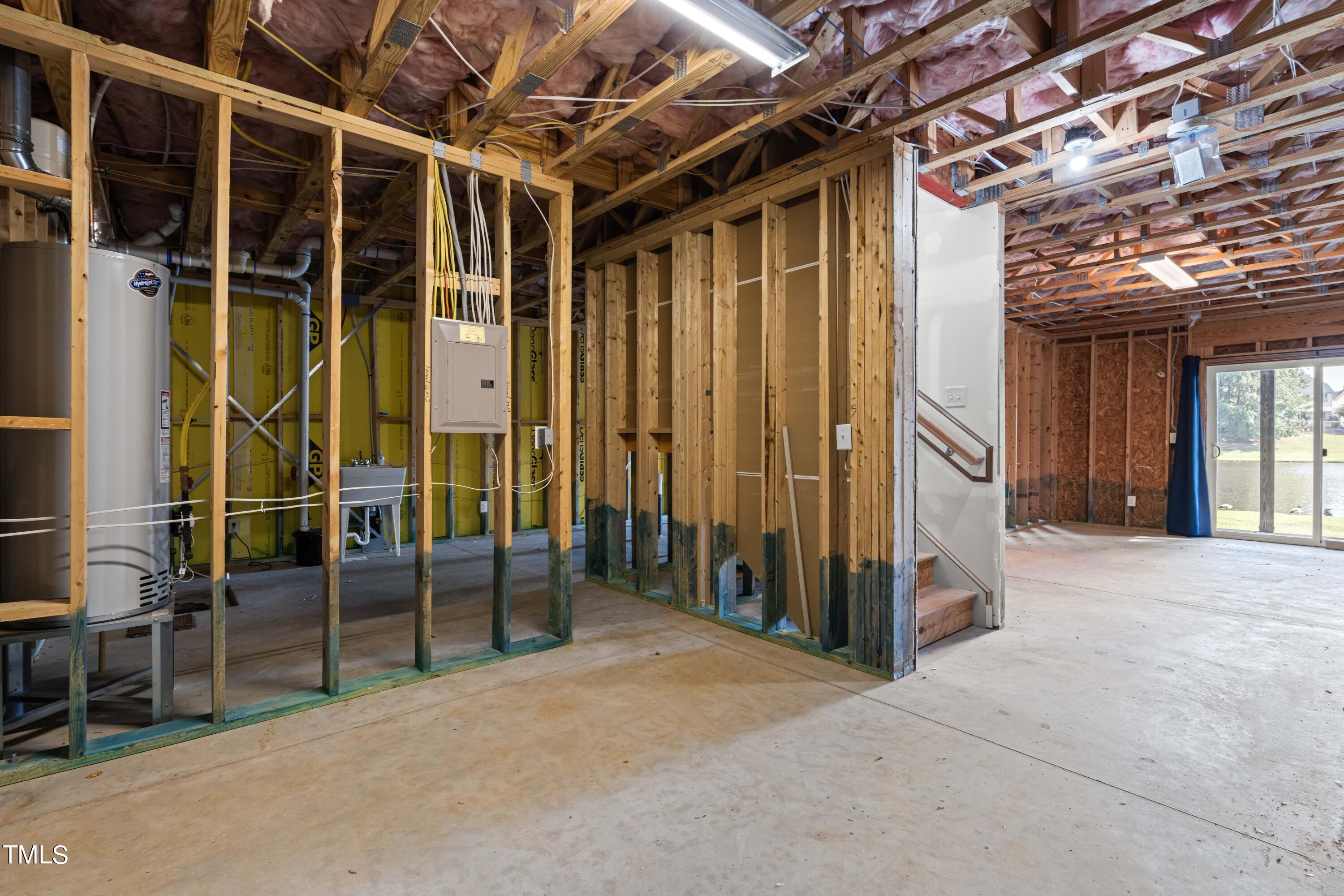 1305 Silver Beach Way Raleigh, NC 27606 - Photo 27 of 47 a view of an empty room with wooden walls