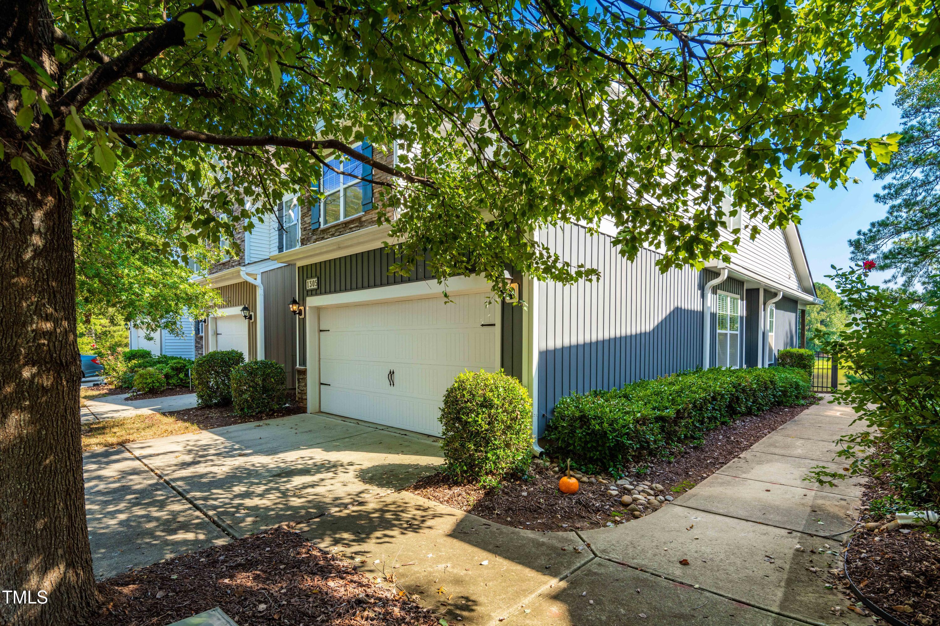 1305 Silver Beach Way Raleigh, NC 27606 - Photo 3 of 47 a view of a house with a tree in the background