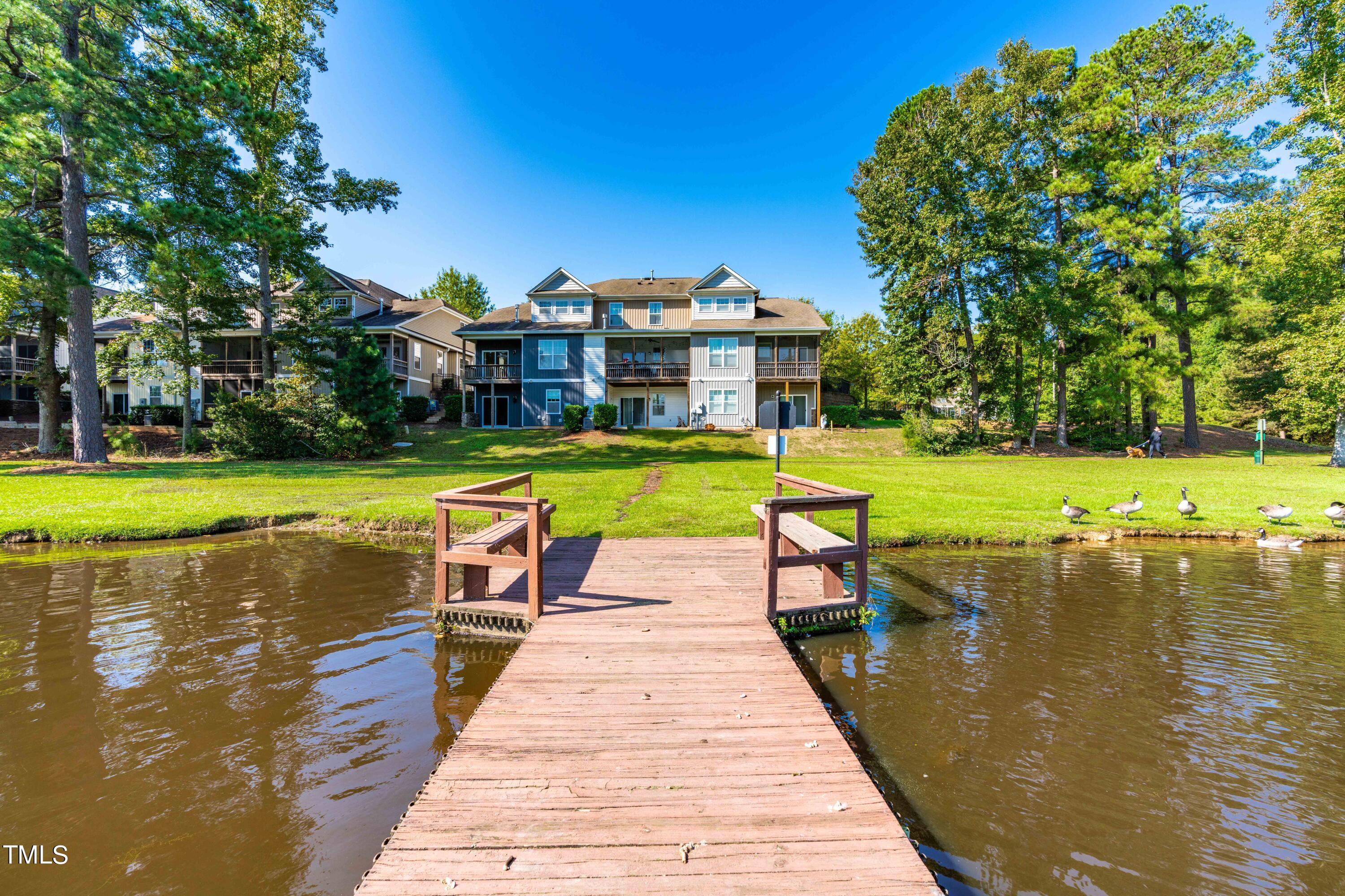 1305 Silver Beach Way Raleigh, NC 27606 - Photo 35 of 47 a view of a swimming pool with a lawn chairs