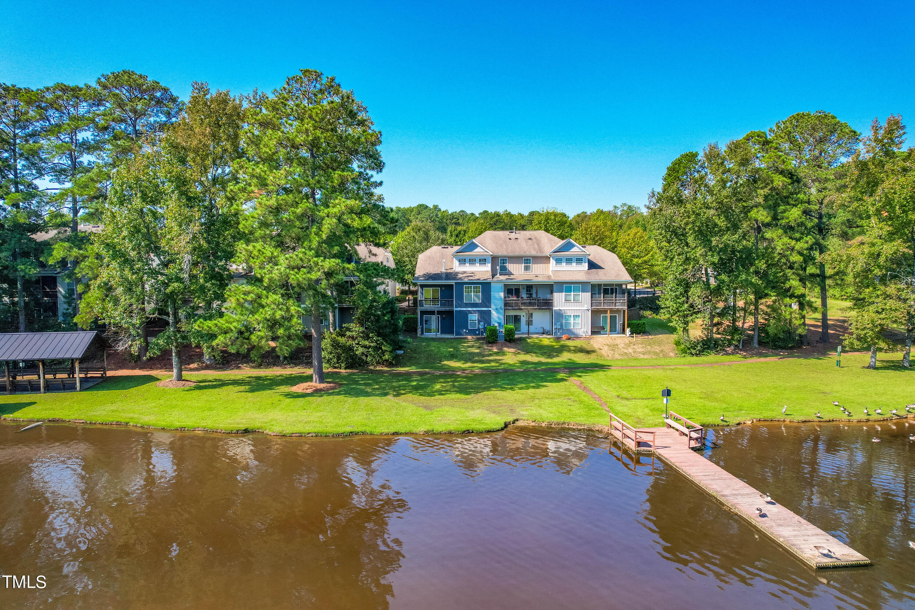 1305 Silver Beach Way Raleigh, NC 27606 - Photo 38 of 47 a front view of a house with swimming pool yard and outdoor seating