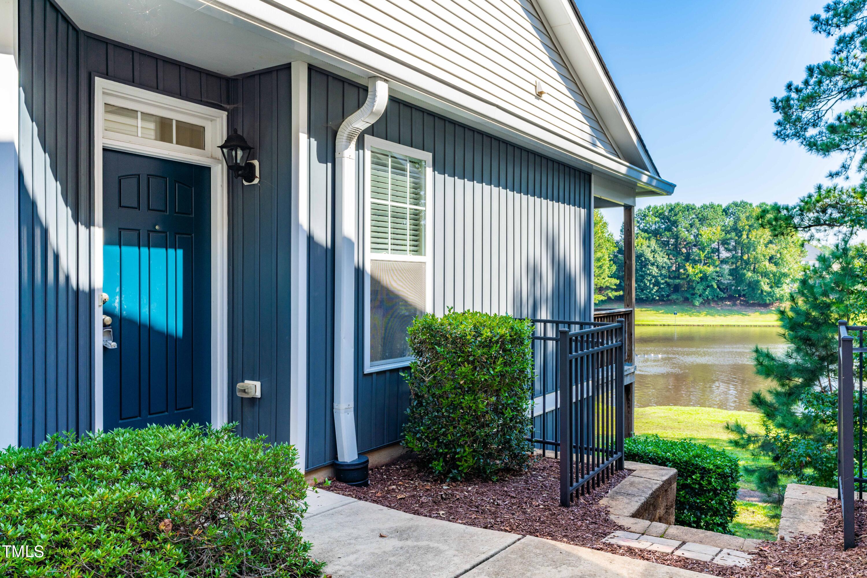 1305 Silver Beach Way Raleigh, NC 27606 - Photo 4 of 47 a front view of a house with garden