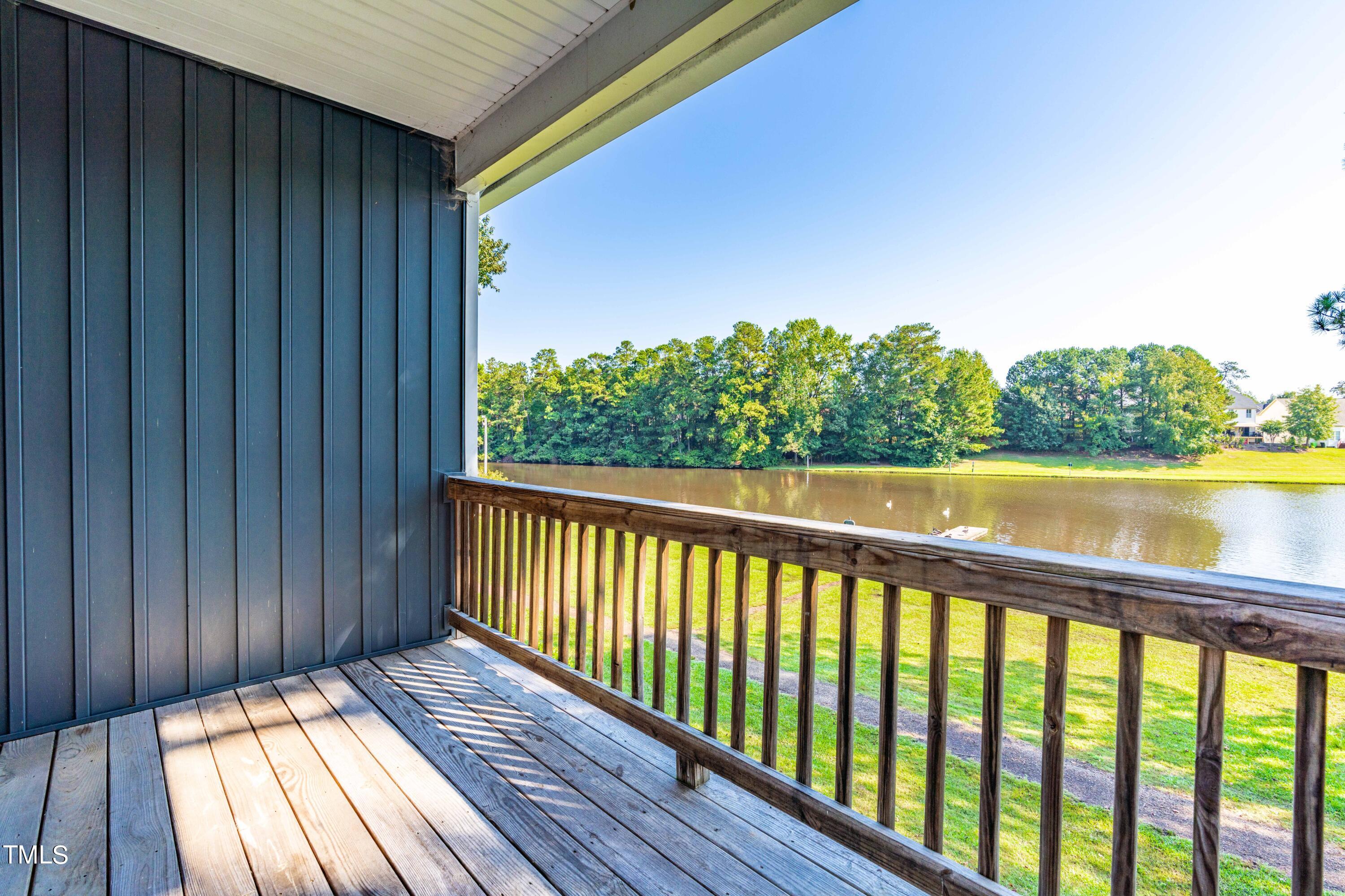 1305 Silver Beach Way Raleigh, NC 27606 - Photo 9 of 47 a view of balcony with wooden floor and fence