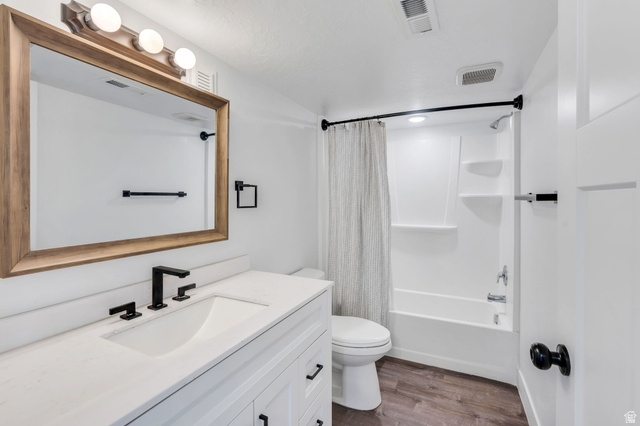 252 North Sunrise Rnch Drive Mapleton, UT 84664 - Photo 44 of 62 Bathroom featuring a white vanity with a white countertop, rectangular undermount sink, and matte black fixtures