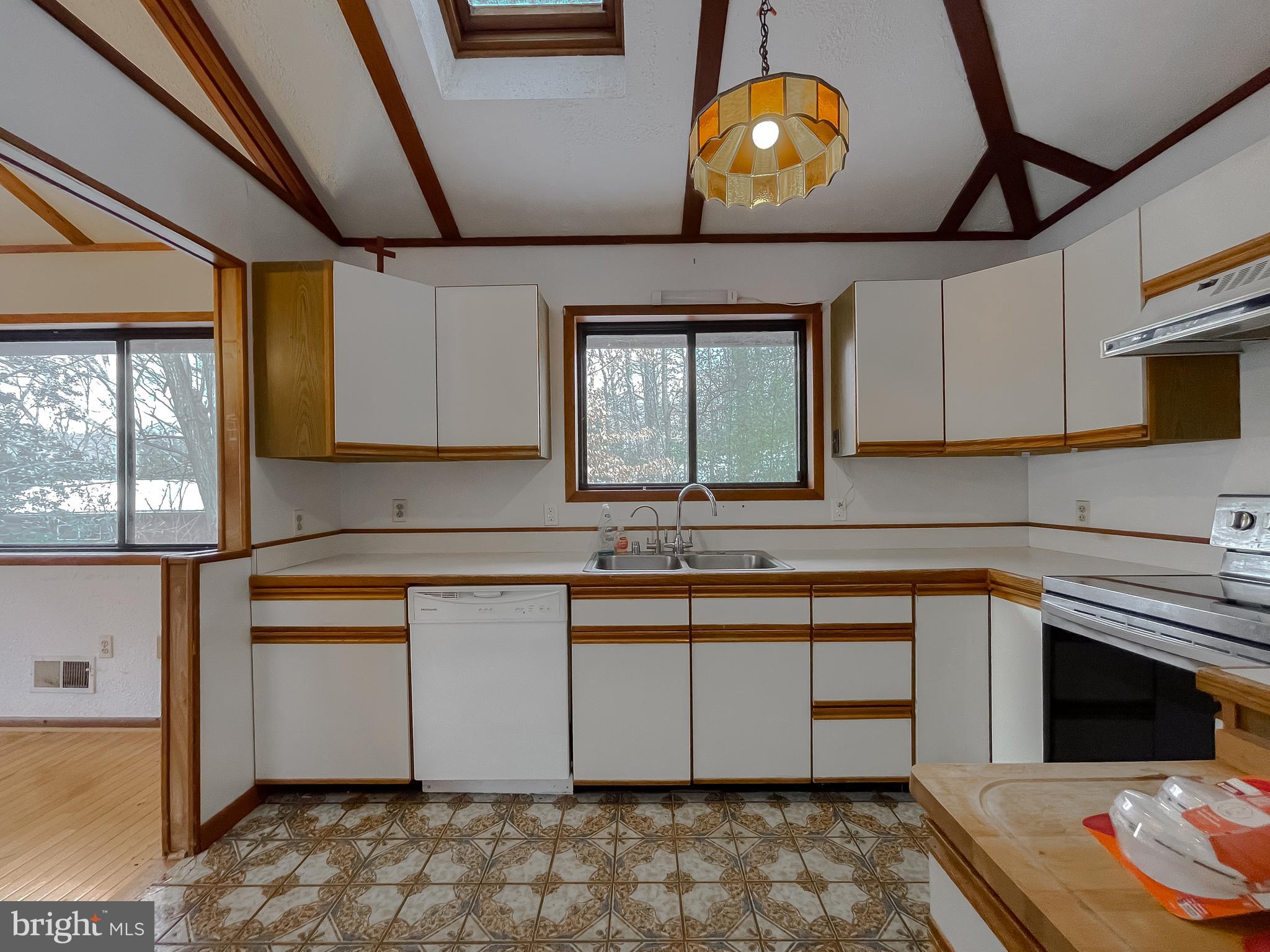 11525 Palo Alto Road Lusby, MD 20657 - Photo 35 of 74 a kitchen with stainless steel appliances granite countertop a sink stove and cabinets