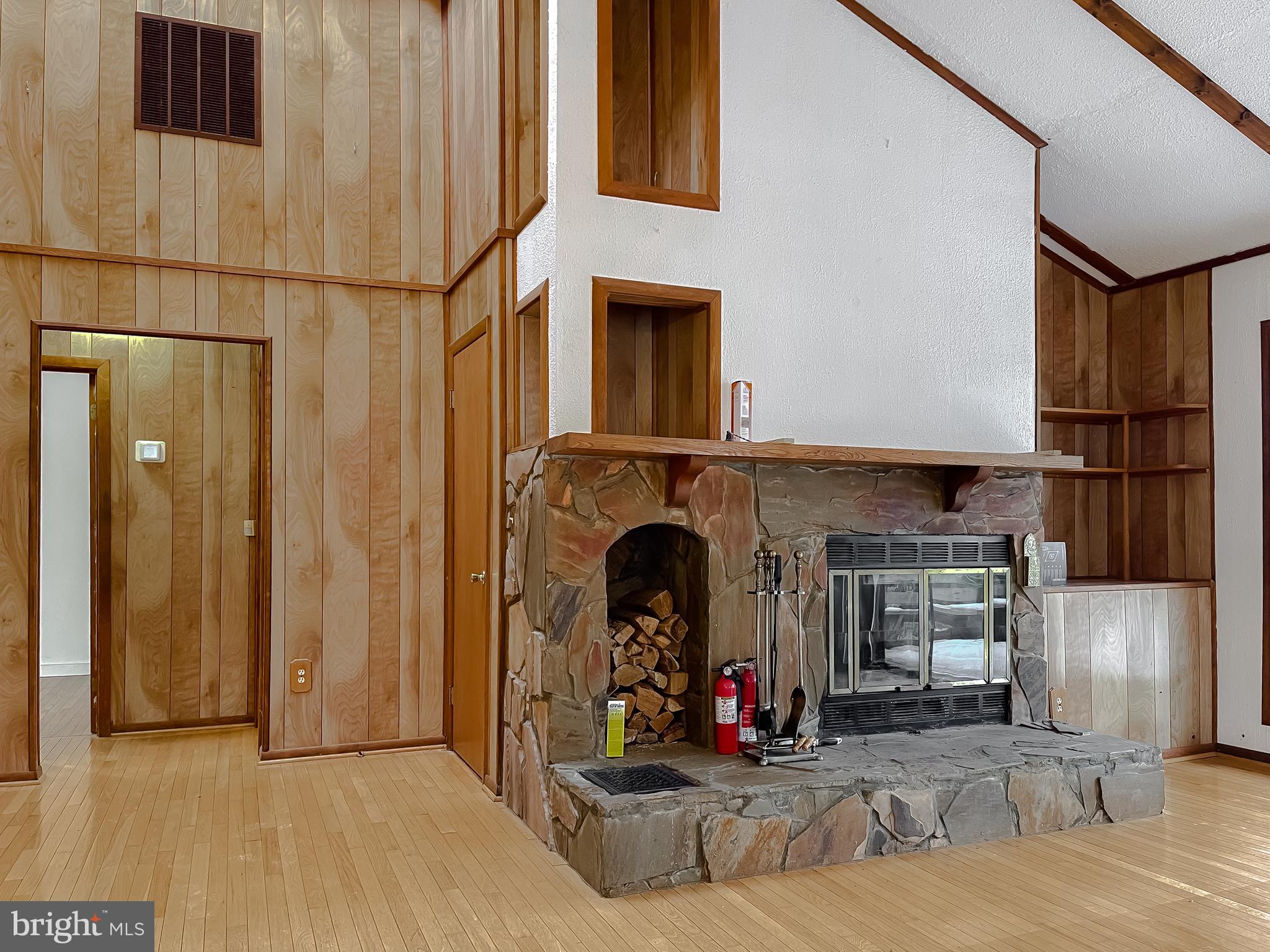 11525 Palo Alto Road Lusby, MD 20657 - Photo 38 of 74 a view of a fireplace and rack on the wall