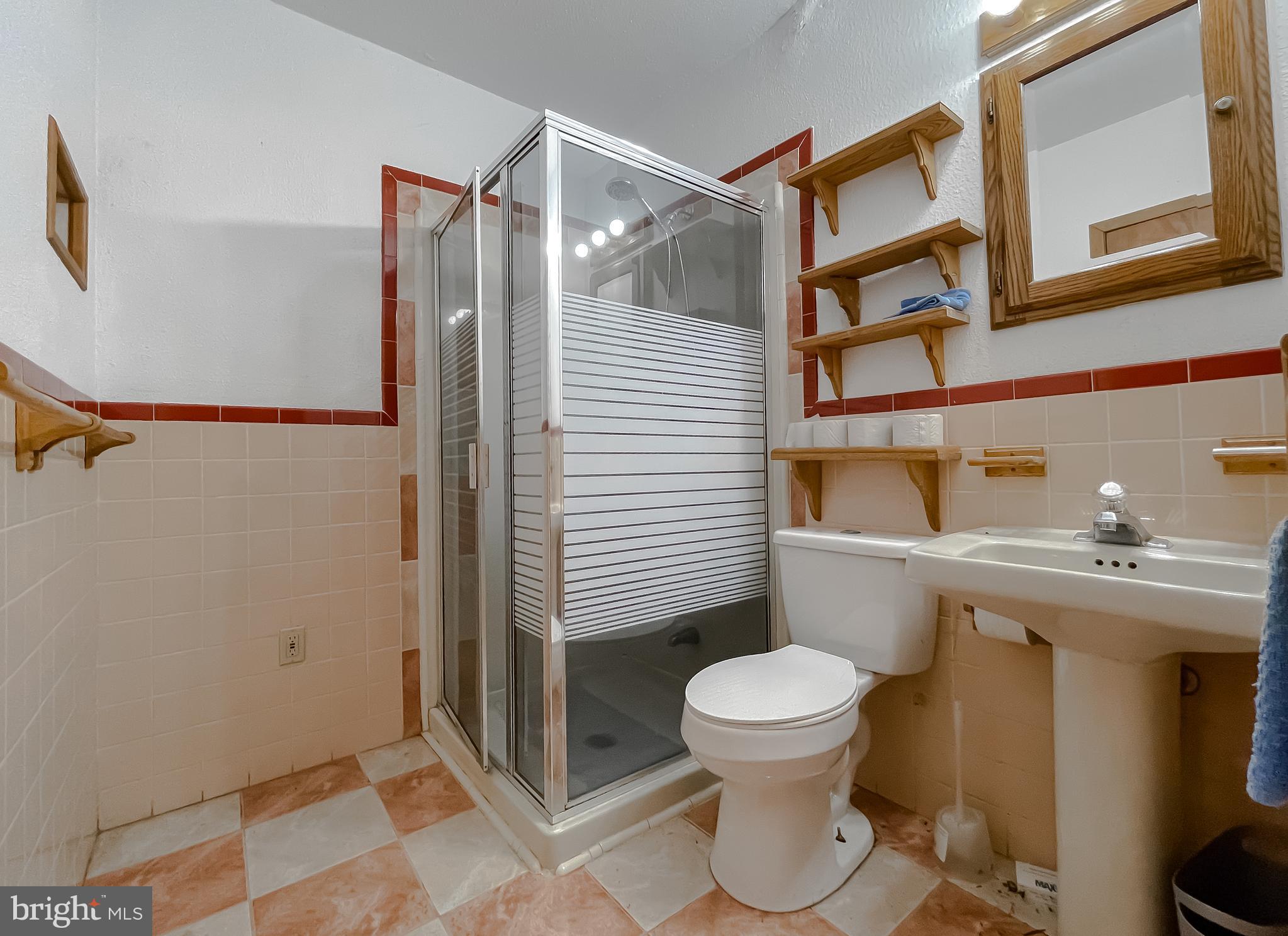 11525 Palo Alto Road Lusby, MD 20657 - Photo 61 of 74 a bathroom with a toilet a sink and a shower