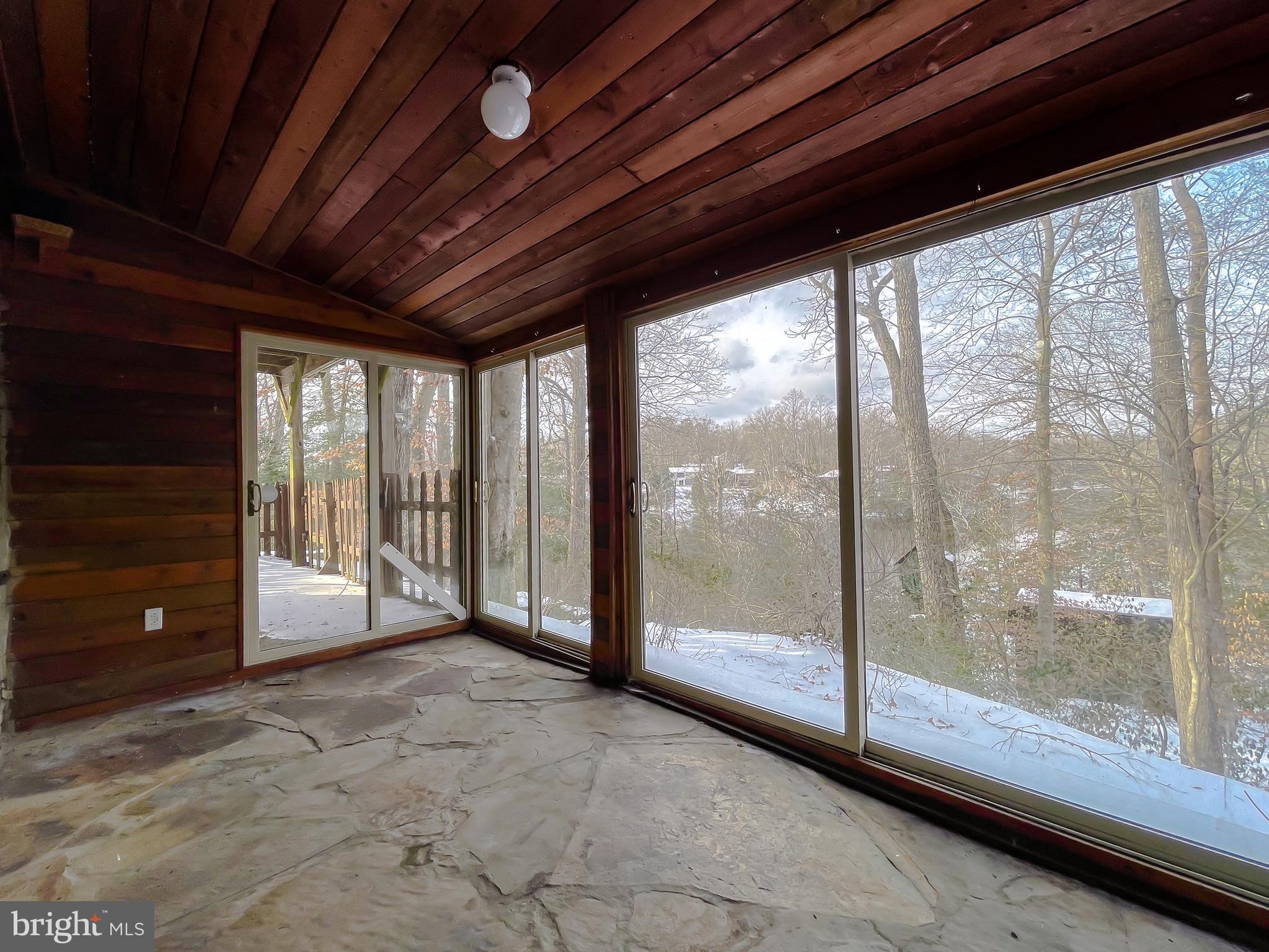 11525 Palo Alto Road Lusby, MD 20657 - Photo 63 of 74 a view of an empty room with sliding glass door and shower