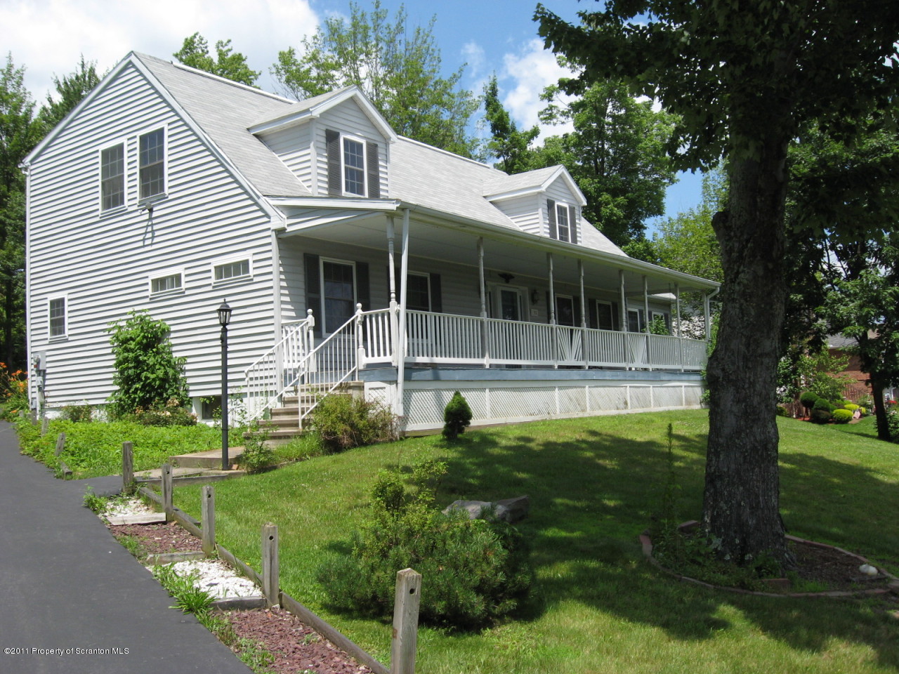 112 Ridgeview Drive Scranton, PA 18504 - Photo 1 of 15 a front view of a house with a yard