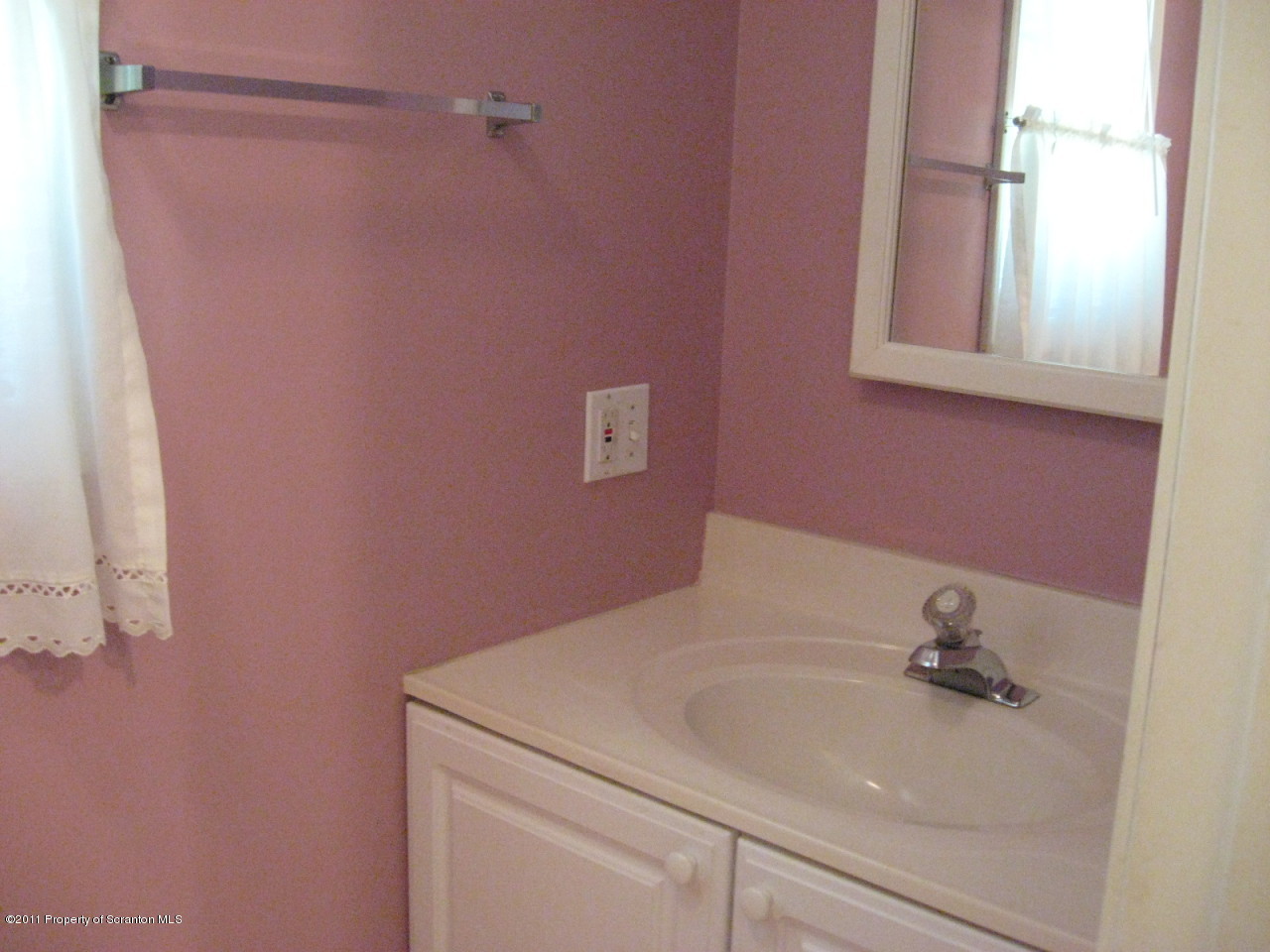 112 Ridgeview Drive Scranton, PA 18504 - Photo 8 of 15 a bathroom with a sink and a mirror