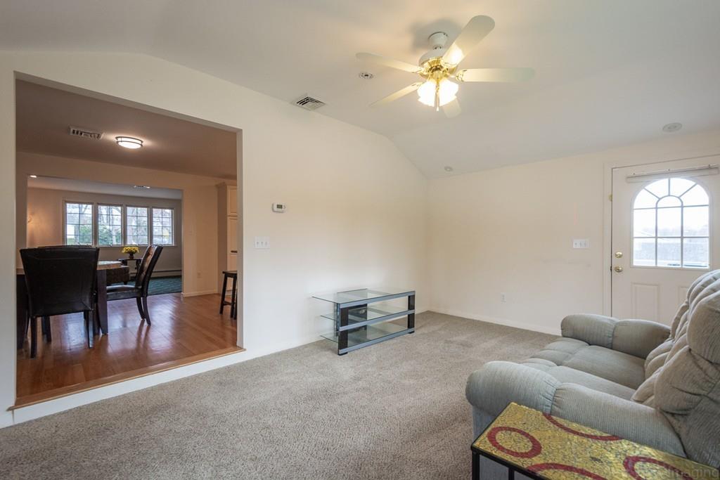 18 Harding Street Milford, MA 01757 - Photo 12 of 28 a living room with furniture and a chandelier