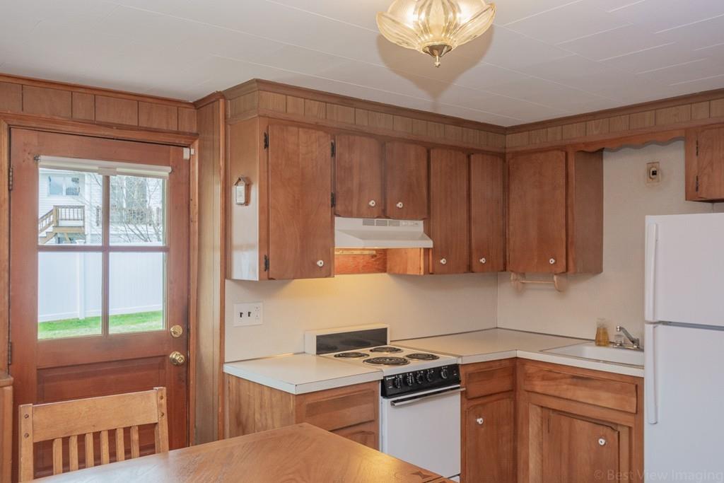 18 Harding Street Milford, MA 01757 - Photo 17 of 28 a kitchen with a stove a sink and a refrigerator