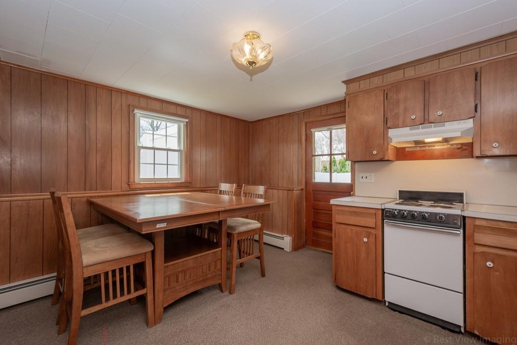 18 Harding Street Milford, MA 01757 - Photo 18 of 28 a kitchen with cabinets stove and window