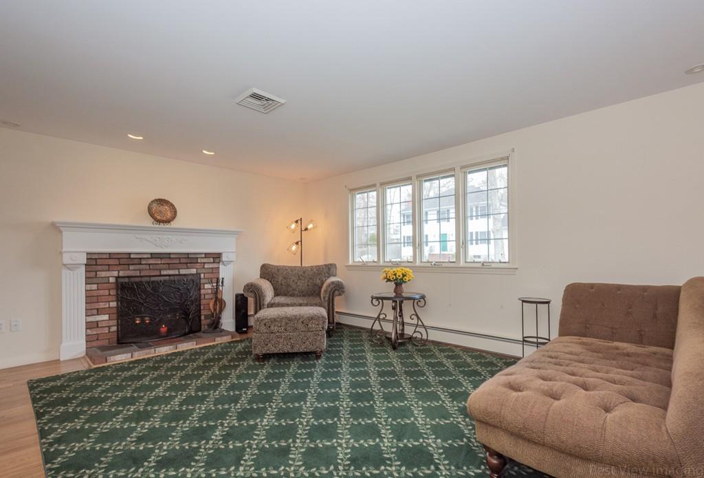 18 Harding Street Milford, MA 01757 - Photo 7 of 28 a living room with furniture and a fireplace