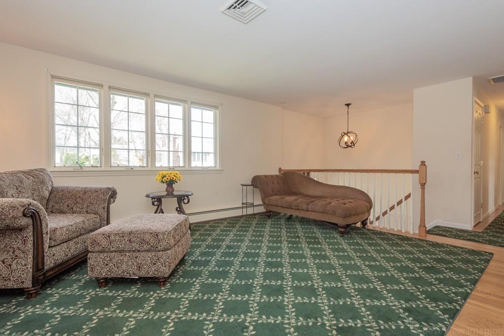 18 Harding Street Milford, MA 01757 - Photo 8 of 28 a living room with furniture and a rug