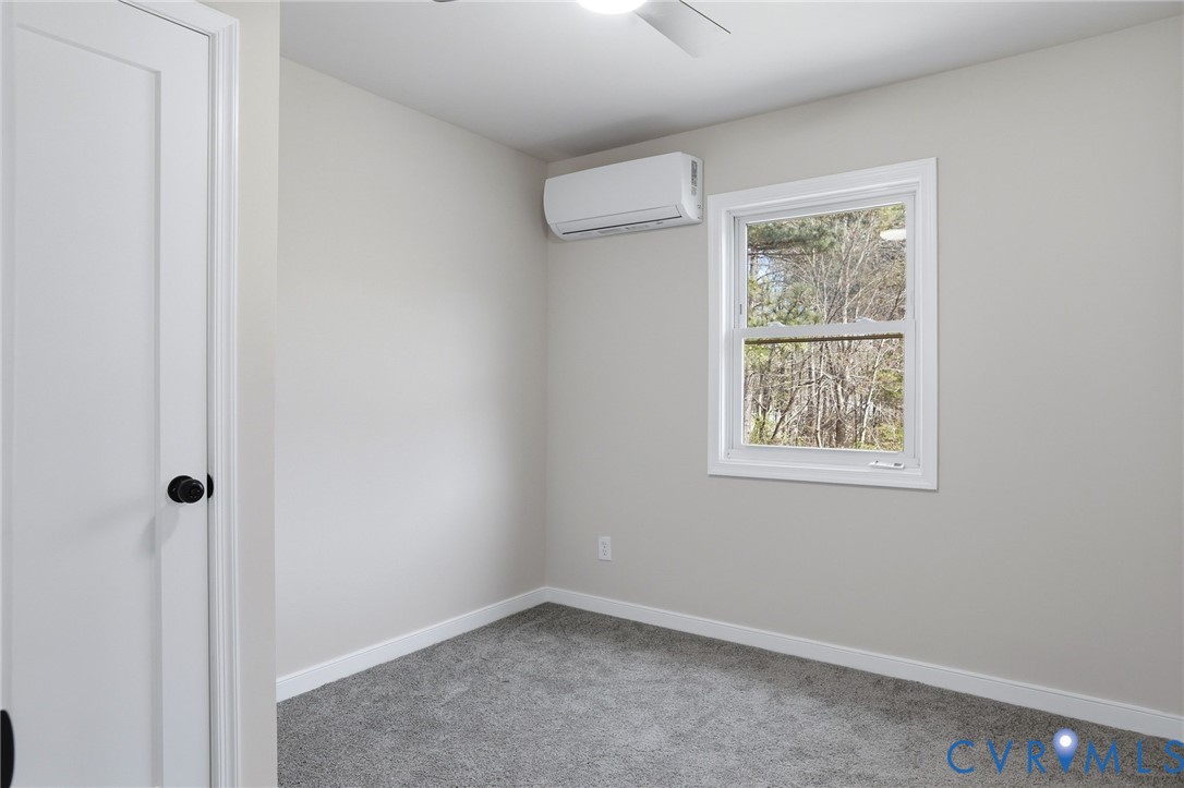 3490 Willow Brook Road Bumpass, VA 23024 - Photo 17 of 29 an empty room with windows