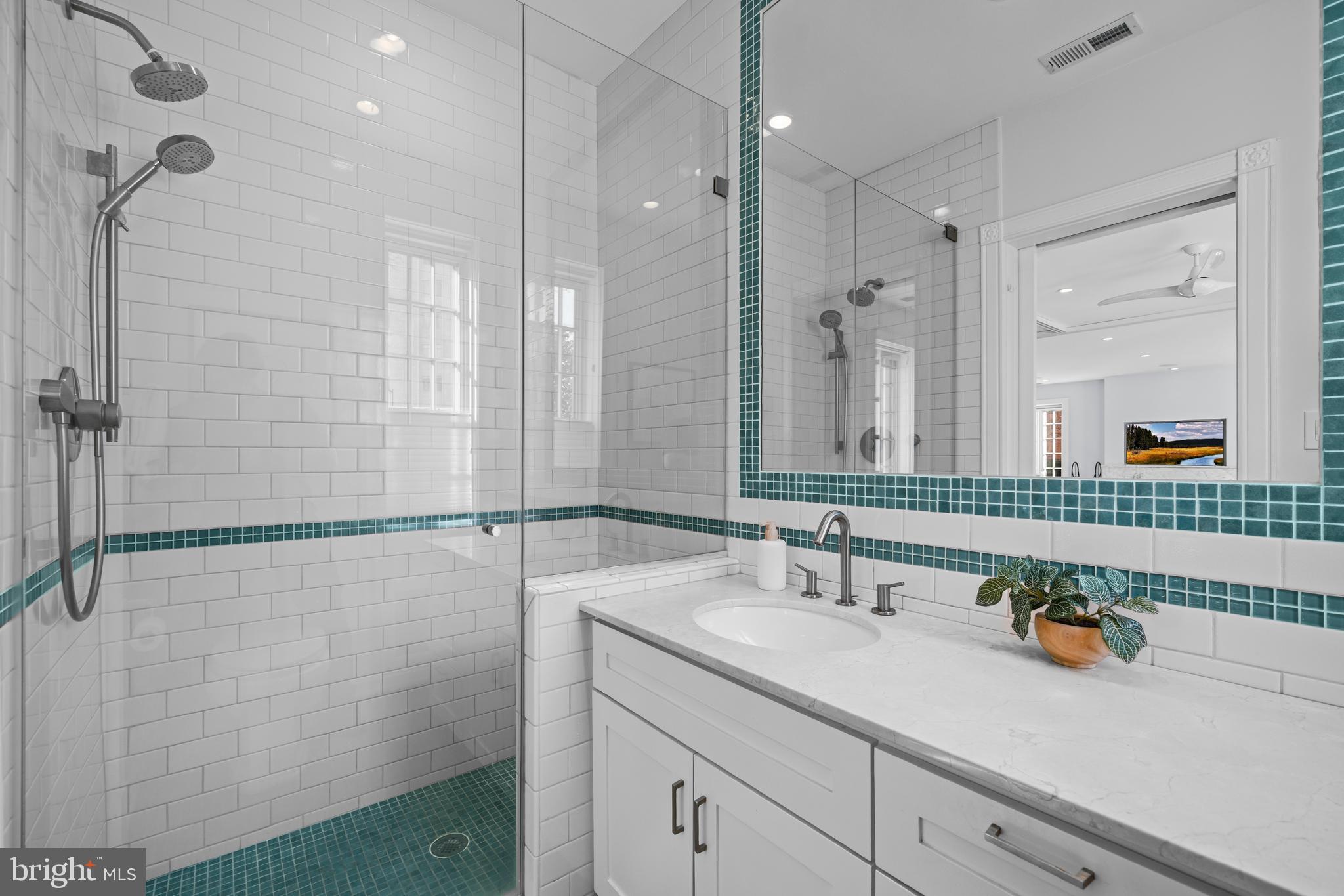 1901 Wyoming Avenue Northwest, Unit 11 Washington, DC 20009 - Photo 17 of 36 a bathroom with a sink and a mirror