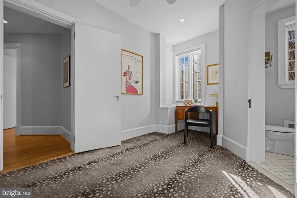a living room with furniture and a rug