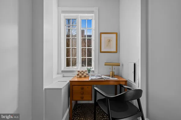 a room with a table and chairs