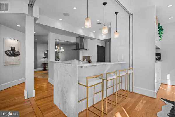 a view of kitchen with cabinets and wooden floor