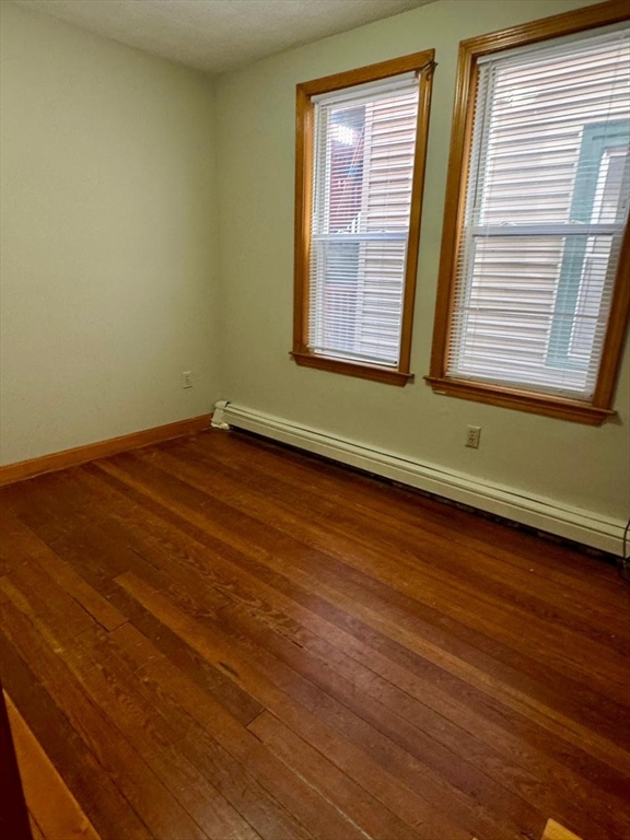68 Maverick Street Chelsea, MA 02150 - Photo 9 of 16 a view of a room with wooden floor and a window