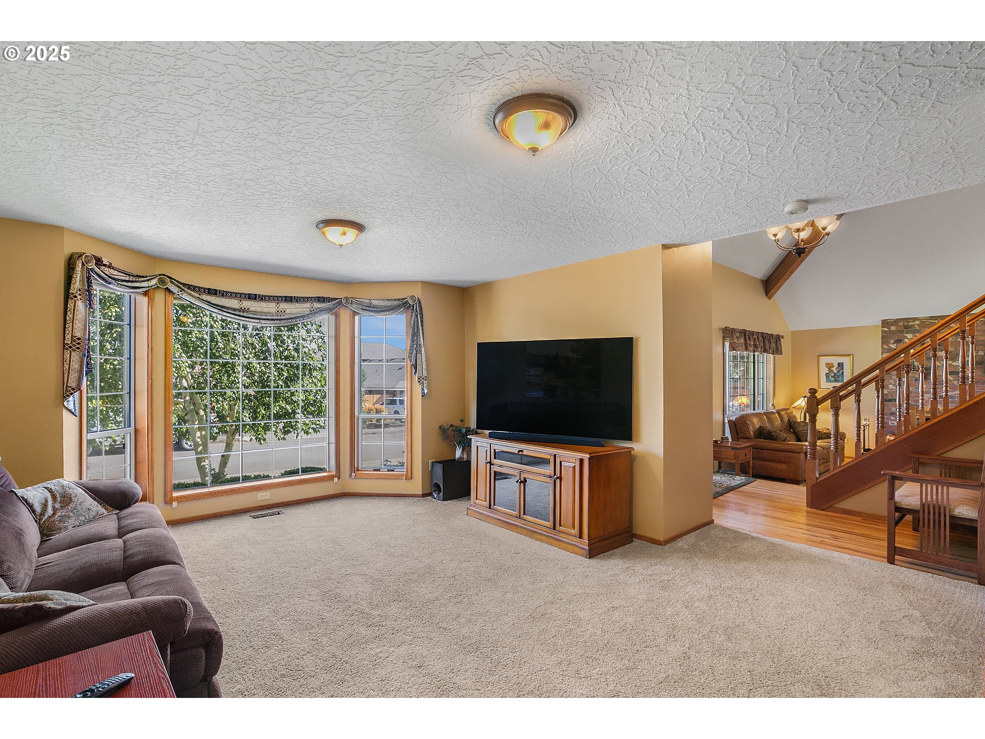 3003 Northeast 164th Street Ridgefield, WA 98642 - Photo 15 of 38 a living room with furniture and a flat screen tv