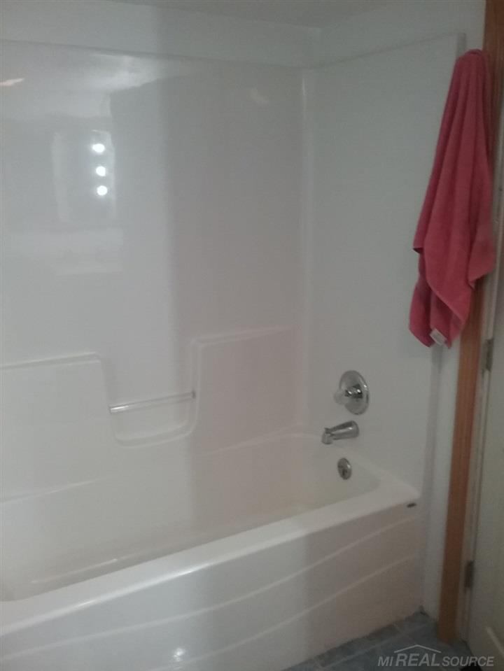 5162 Montgomery Road Marlette, MI 48453 - Photo 20 of 22 Lower Bathroom shower and bath tub