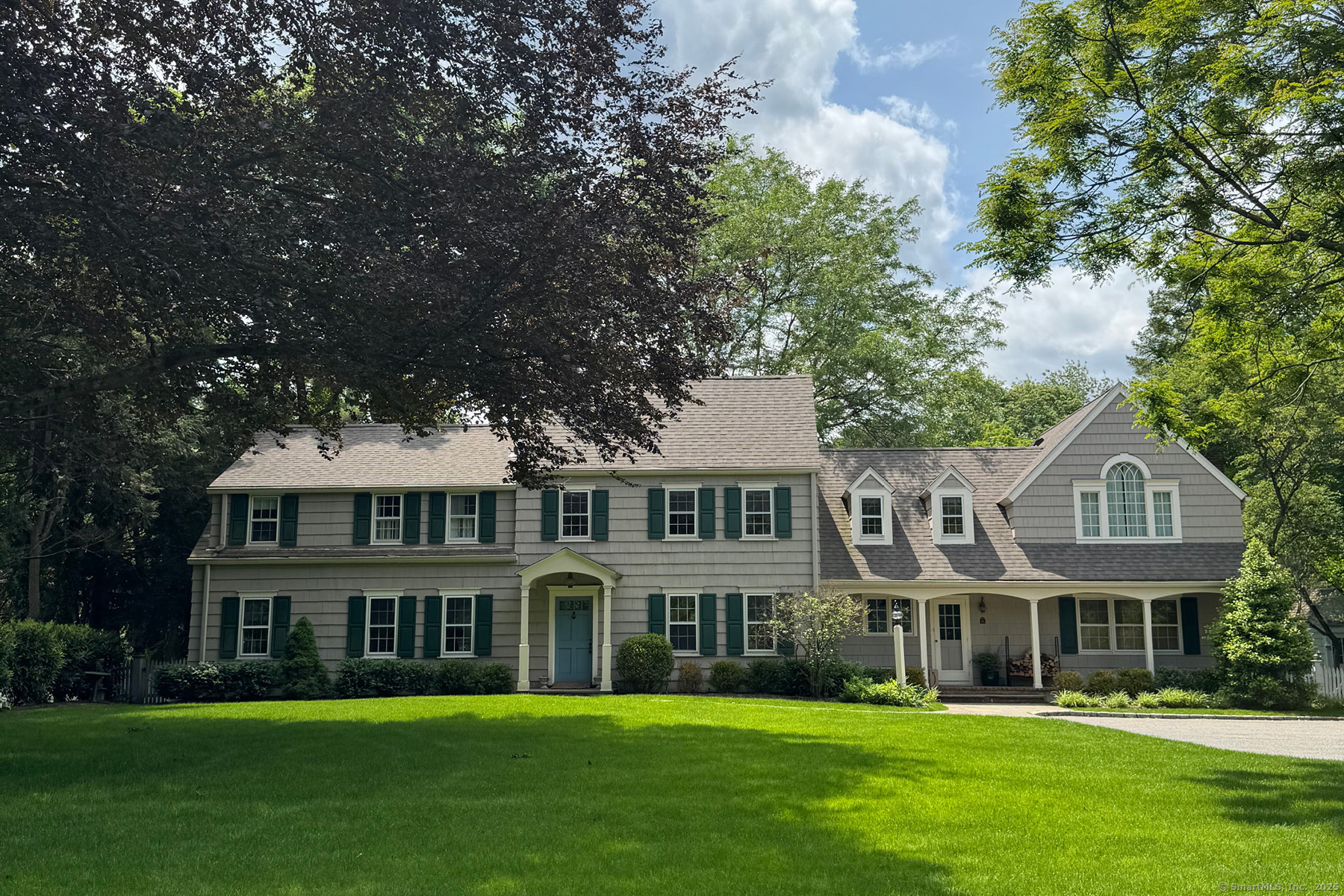 95 Compo Road North Westport, CT 06880 - Photo 17 of 28 a front view of a house with a garden