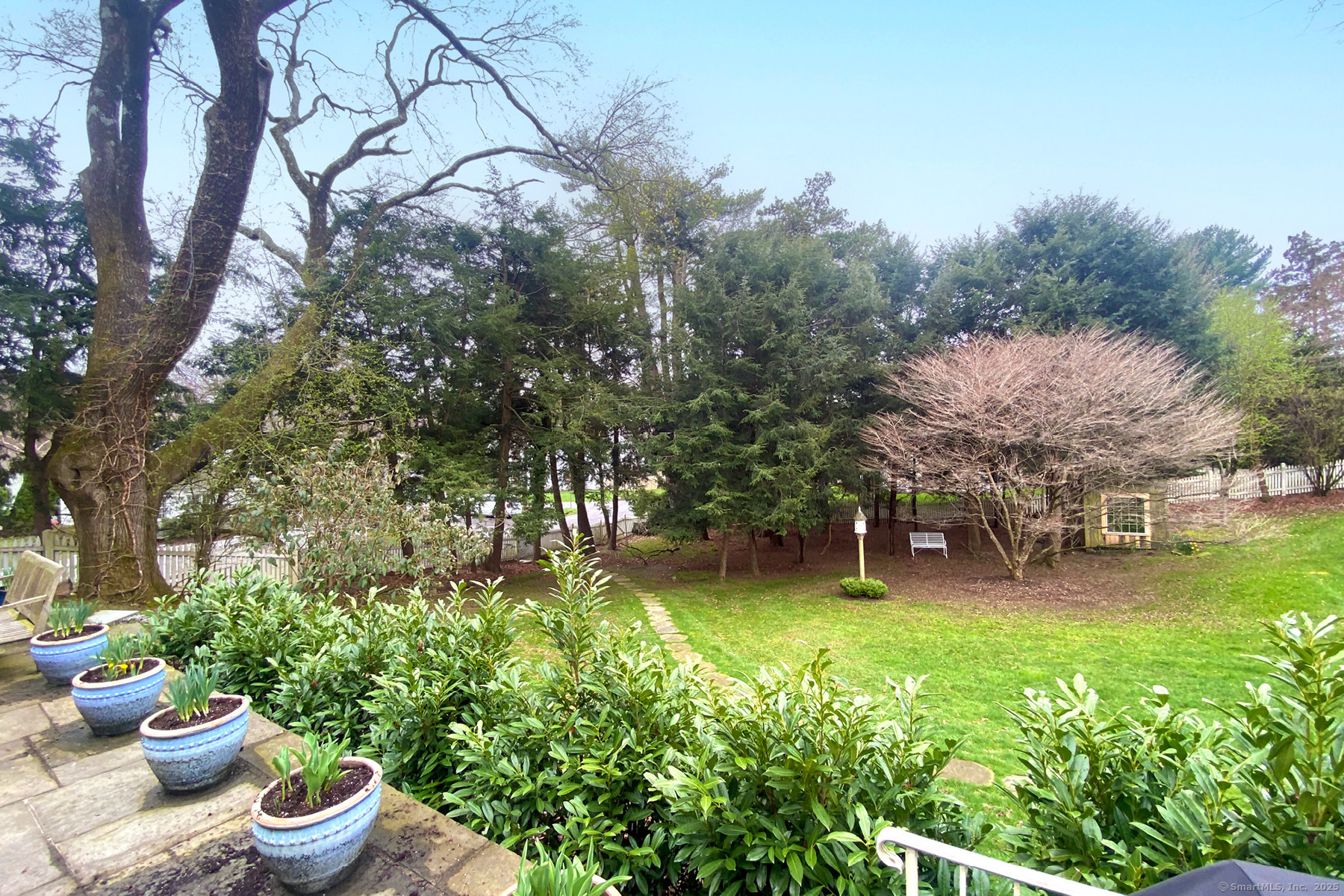 95 Compo Road North Westport, CT 06880 - Photo 25 of 28 a view of a backyard with plants and a patio
