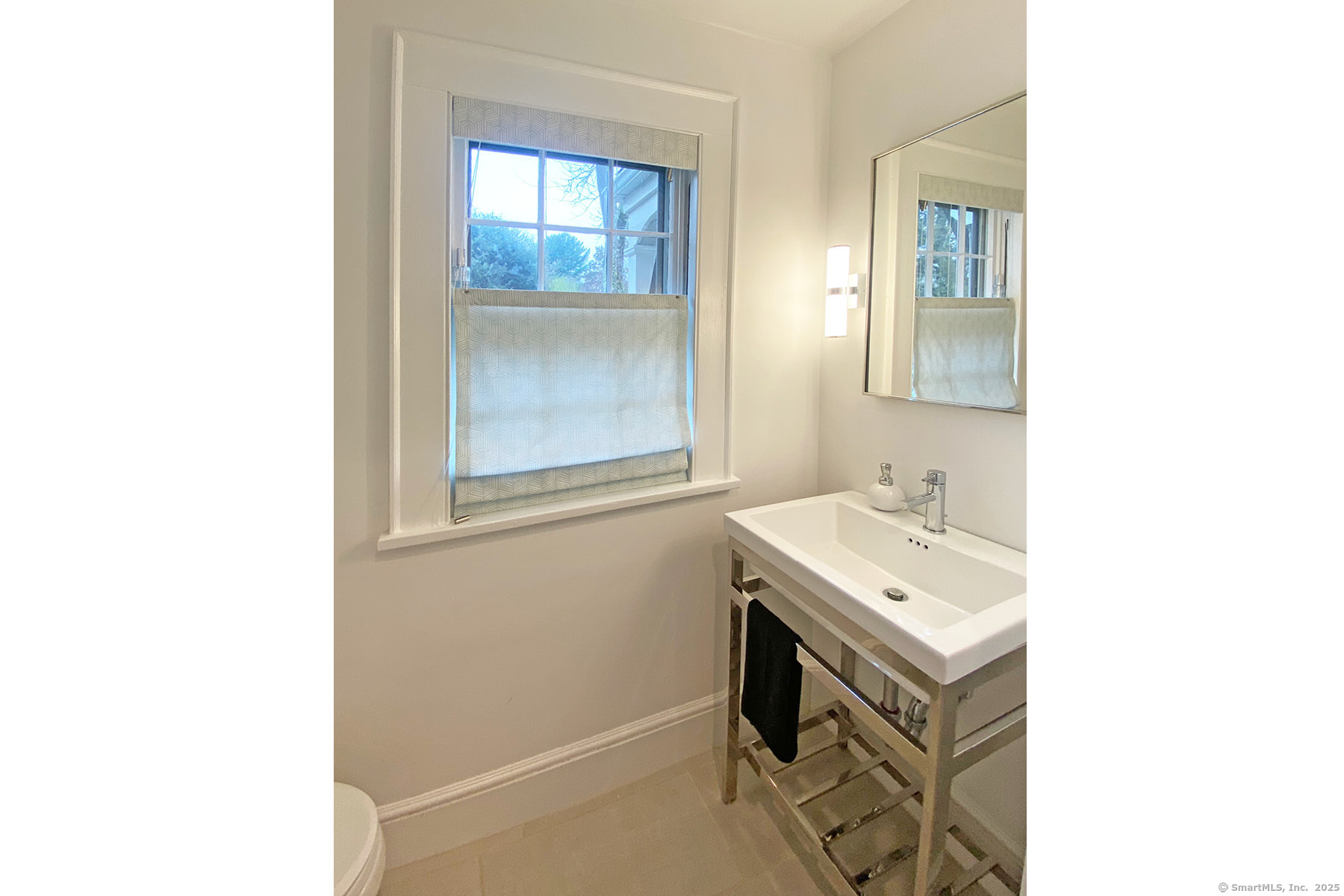 95 Compo Road North Westport, CT 06880 - Photo 28 of 28 a bathroom with a sink a toilet and a mirror