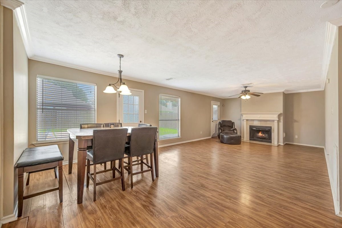 4235 Park Ridge Drive Pasadena, TX 77504 - Photo 12 of 41 a view of a dining room with furniture window and wooden floor