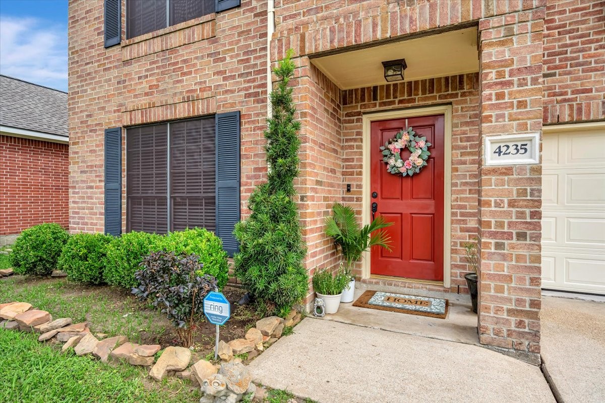4235 Park Ridge Drive Pasadena, TX 77504 - Photo 2 of 41 a front view of a house with garden