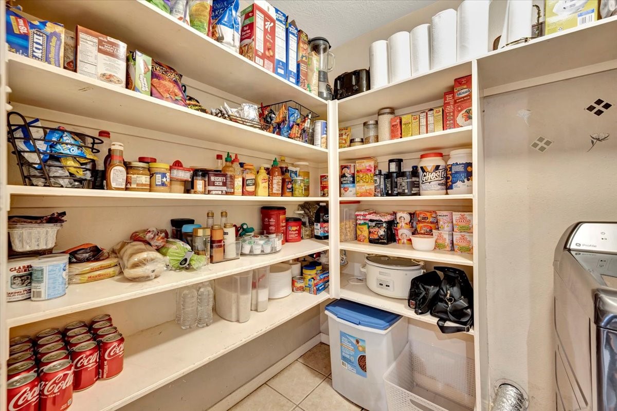 4235 Park Ridge Drive Pasadena, TX 77504 - Photo 21 of 41 a shelf with cup and plates