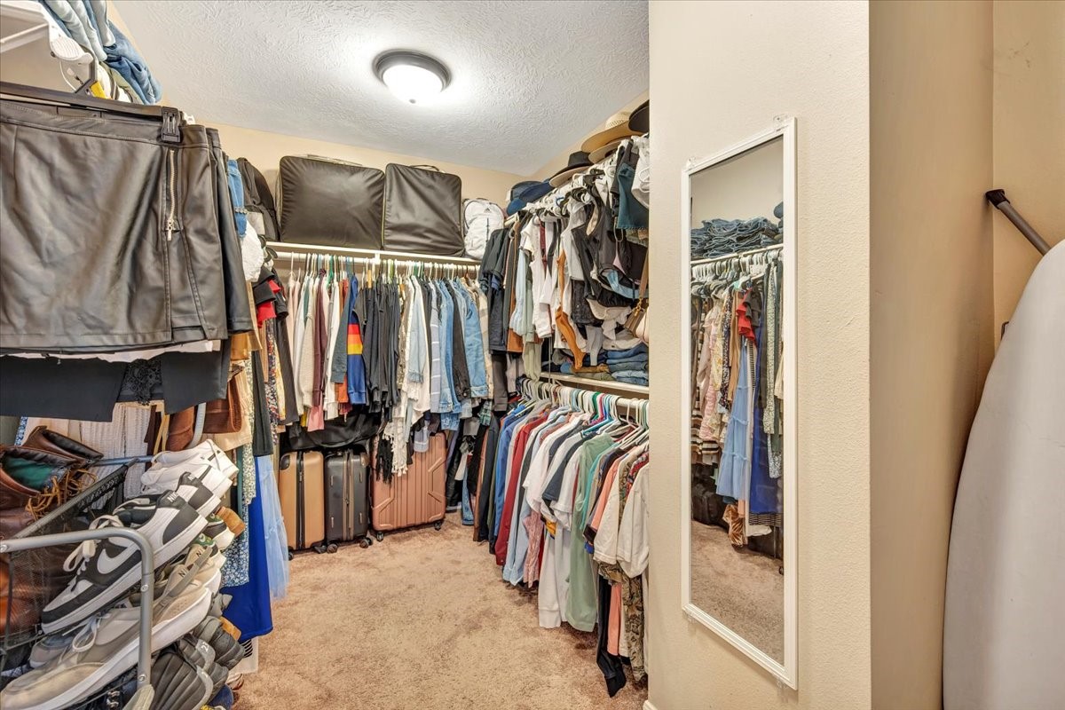 4235 Park Ridge Drive Pasadena, TX 77504 - Photo 34 of 41 a view of walk in closet with clothes