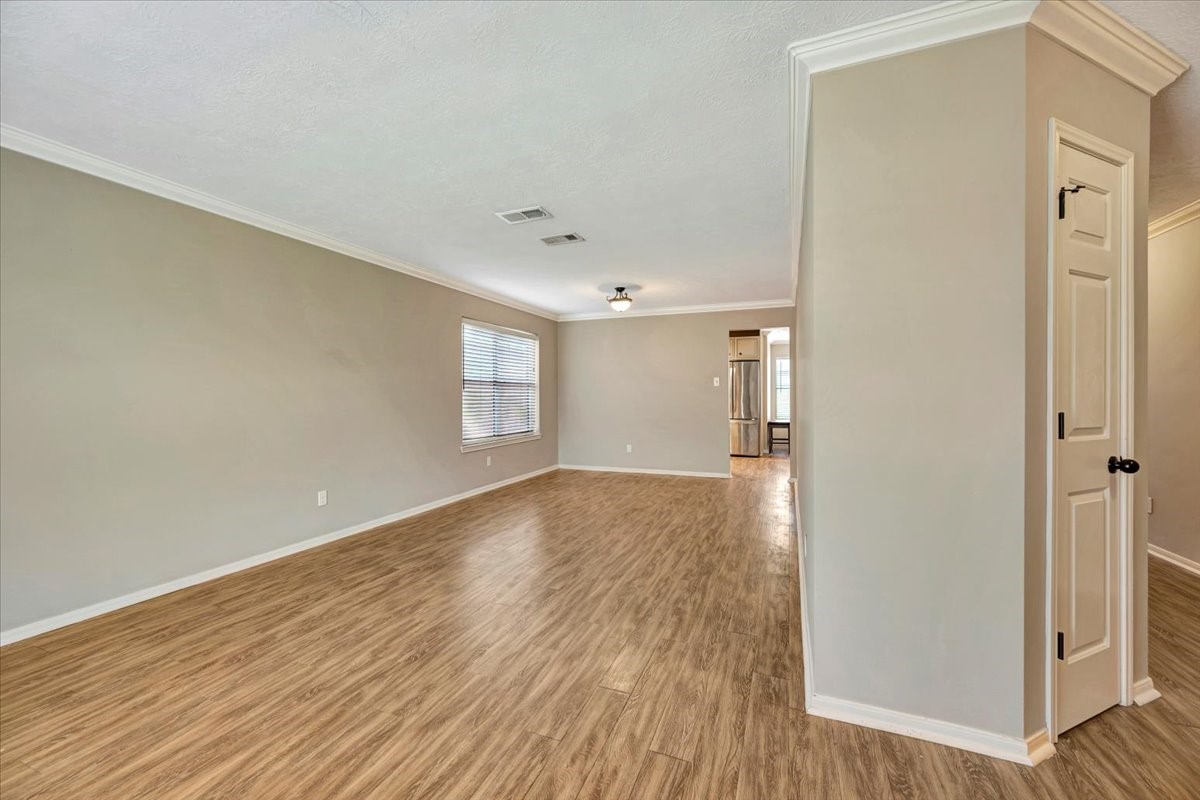 4235 Park Ridge Drive Pasadena, TX 77504 - Photo 9 of 41 a view of empty room with wooden floor and window