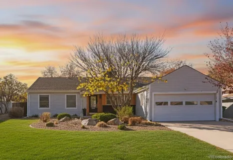 a front view of house with yard outdoor seating and barbeque oven