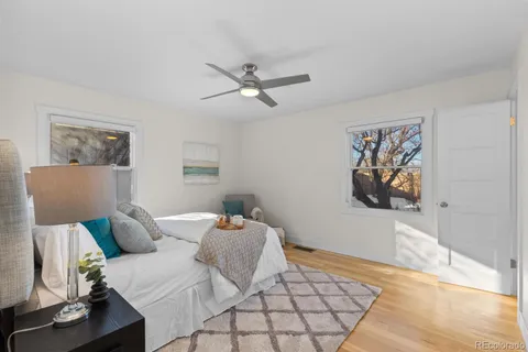 a bedroom with a bed and window