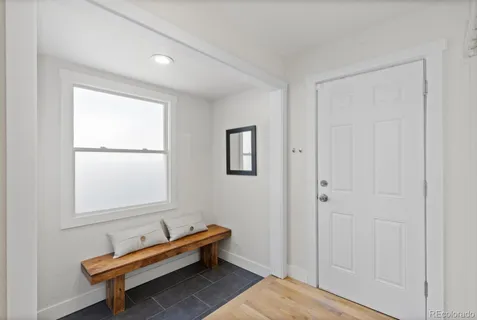 a view of entryway with wooden floor