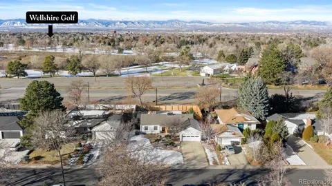 an aerial view of a house with a yard and a garage