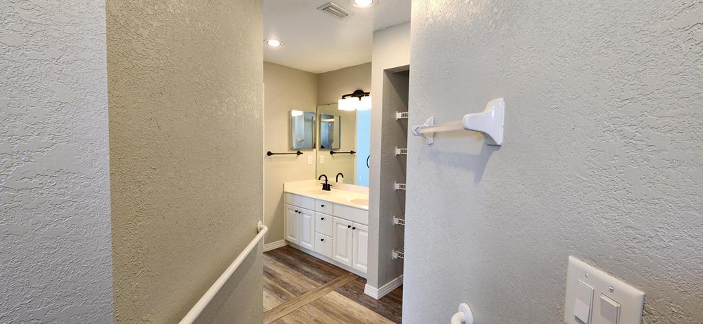 6554 Fairway Gardens Drive, Unit 6554 Bradenton, FL 34203 - Photo 12 of 25 a bathroom with a sink and a mirror