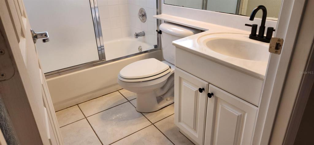 6554 Fairway Gardens Drive, Unit 6554 Bradenton, FL 34203 - Photo 15 of 25 a bathroom with a sink toilet and shower