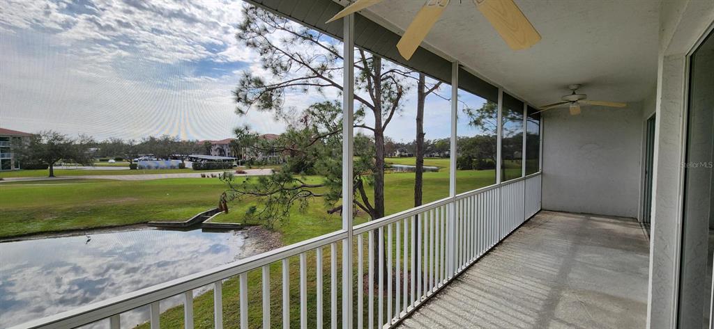 6554 Fairway Gardens Drive, Unit 6554 Bradenton, FL 34203 - Photo 18 of 25 a view of a porch with a yard
