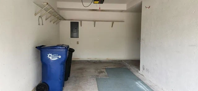 a balcony with table and chairs potted plants with wooden floor