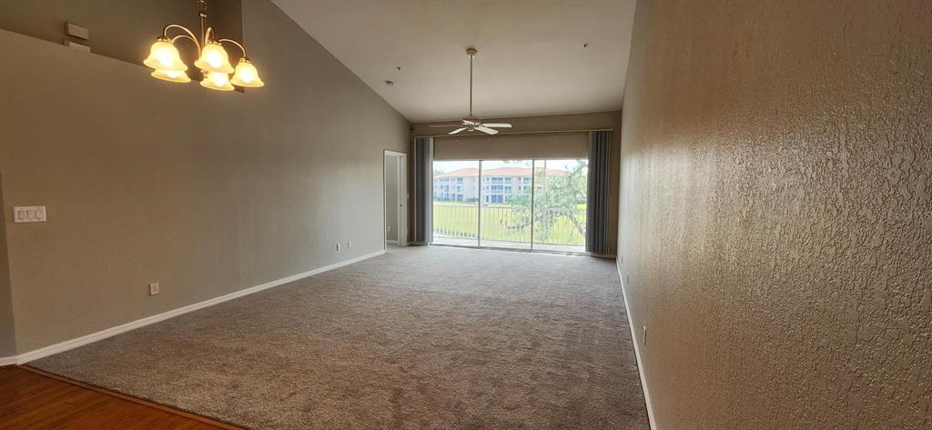 6554 Fairway Gardens Drive, Unit 6554 Bradenton, FL 34203 - Photo 6 of 25 a view of an empty room with a window