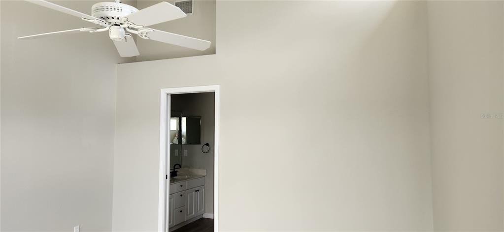 6554 Fairway Gardens Drive, Unit 6554 Bradenton, FL 34203 - Photo 8 of 25 a view of a hallway with a chandelier fan
