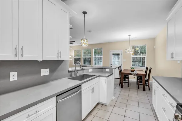 a kitchen with a sink and cabinets