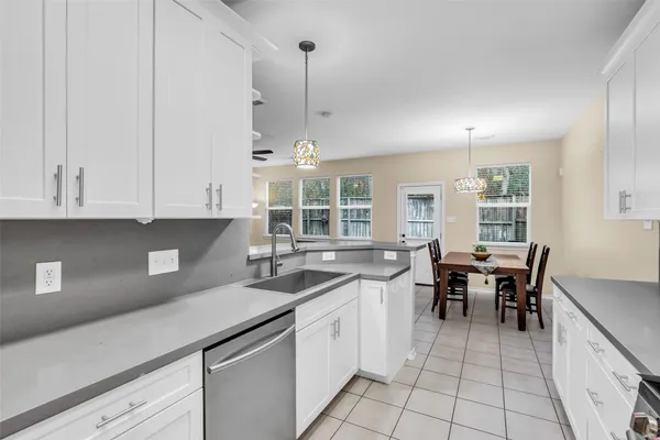 a kitchen with a sink and cabinets