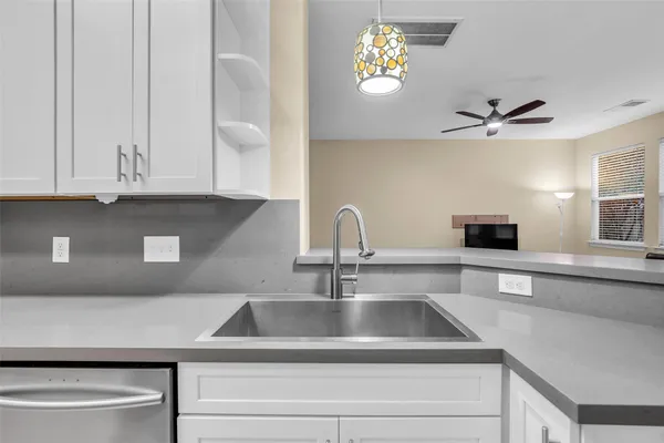 a kitchen with a sink and a cabinets