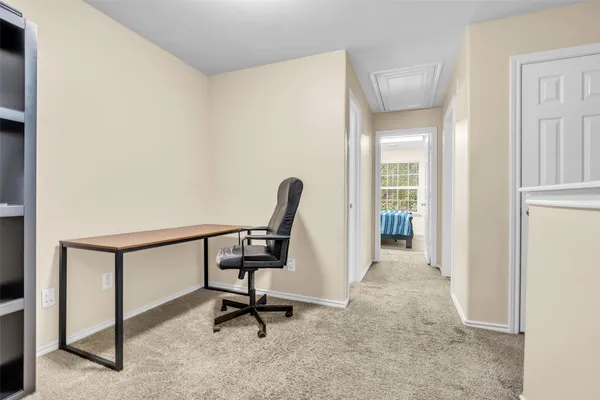 a view of a hallway with workspace